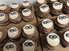 some cupcakes are decorated with brown icing and black eyeballs on them