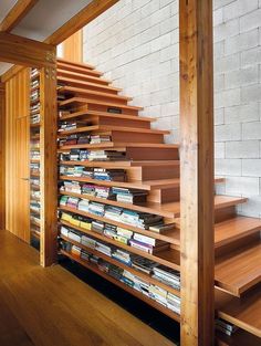 some books are stacked up on the stairs