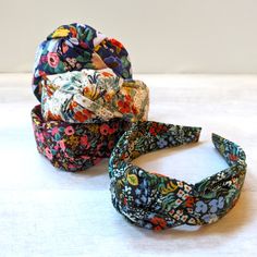 "Top Knot Headband | Rifle Paper Co | Knotted Headband | Gift for Her | Knot Headband | Wide Headband | Women's Headband | Floral Headband These beautiful top knot headbands are hand-made and designed for comfort and style. They're the perfect accessory to add a finishing touch to any outfit and ensure that you have a good hair day every day! ::details:: - hand stitched using beautiful Rifle Paper Co fabric - measures approximately 16\" from end to end - headband base is plastic, flexible, and sits comfortably on your head - fits children (ages 5+) and most adults with a small/medium head size These accessories make a perfect gift! Because my products are individually handmade, variations may occur, and colors and pattern placement will vary slightly from pictures shown. Matching and coord Top Knot Headbands, Wide Headband, Floral Headbands, Good Hair Day, Headbands For Women, Knot Headband, Top Knot, Fall Collections, Hair Accessories Headbands