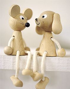 two wooden mice sitting on top of a shelf