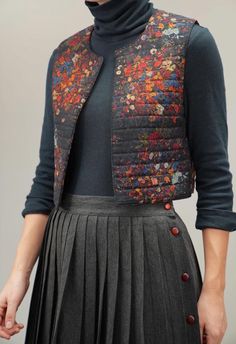 This exquisite Ted Lapidus quilted vest from the 1980s combines artistic charm with sophisticated warmth. Crafted from wool with a nylon-filled padding, the vest showcases a stunning floral print that feels reminiscent of French countryside tapestries--rich in colors and intricate in design. Its cropped, boxy fit makes it a versatile layering piece, perfect over a turtleneck or dress to add a touch of vintage elegance to your look. In excellent vintage condition, this piece is a rare find for an Quilted Flower, Tapestry Vest, Ted Lapidus, Flower Tapestry, French Countryside, Vintage Elegance, Quilted Vest, Vest Outfits, Layering Pieces