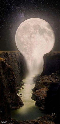 the moon is shining brightly in the night sky over a body of water with rocks on both sides