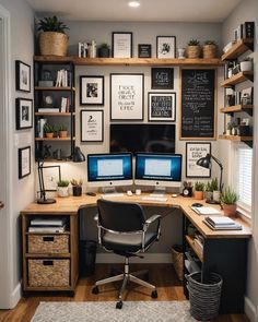 a home office with two computer screens and lots of pictures on the wall above it