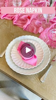 a table with pink napkins and silverware on it, along with the words rose napkin