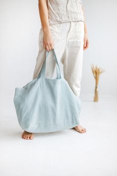 "Large linen bag for a long-awaited summer holiday, picnic, or trip to the beach. Made of soft heavyweight linen that feels lovely to the touch. Roomy enough to carry large towels along with other essentials. The bag has an extra linen lining so it can withstand heavier items. * Which is your favorite color? Ocean / Olive / Terracotta. Beach bag approx. size: Height: 35 cm / 14\" Length: 45 cm / 18\" Width: 22 cm / 9\" Handles: 26 cm / 10\" (Strap drop length) \"Custom size available. Please wri Blue Cotton Beach Bag For Summer, Blue Cotton Summer Beach Bag, Blue Cotton Canvas Bag For Vacation, Beach Cotton Bags With Pockets, Cotton Beach Bags With Pockets, Summer Beach Shoulder Bag With Pockets, Large Capacity Linen Canvas Bag For Travel, Summer Beach Linen Canvas Bag, Eco-friendly Linen Shoulder Bag For Beach