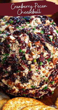 cranberry pecan cheeseball on a cutting board with crackers