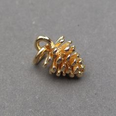 A sweet 3D gold vermeil over sterling silver pine cone pendant charm finished with a 6mm 14k gold fill open jump ring.  The finished dangle measures 14mm x 8mm (25mm = 1 inch) Oxidized Silver Version: https://www.etsy.com/listing/864977210/sterling-silver-pine-cone-necklace-charm Bright Silver Version: https://www.etsy.com/listing/1084853145/sterling-silver-pine-cone-charm-pine  MORE Charms,, Dangles and Pendants: http://www.thedanglediva.etsy.com FOLLOW me: www.facebook.com/thedanglediva for ne Pine Cone Pendant, Pine Cone Necklace, Fertility Bracelet, Pinecone Necklace, Pinecone Pendant, Interchangeable Earrings, Fruit Jewelry, Nature Necklace, Necklace Charm