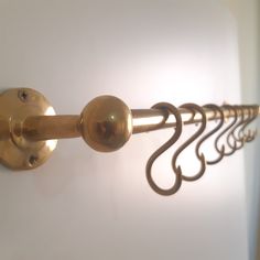 a close up of a metal curtain rod