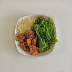 broccoli, mashed potatoes and green beans in a white bowl on a table