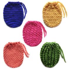 four crocheted potholders in different colors on a white background with the handles down