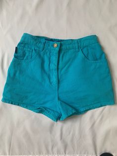 Glorious 1980s teal denim hot pants shorts by 'outpost'.  Marked size 10, waist approx 26", 12" waistband to hem.  In very good vintage condition. Retro High Waist Jean Shorts For Summer, Retro High-waist Jean Shorts For Summer, Turquoise Shorts For Spring, Retro High-waisted Jean Shorts With Built-in Shorts, Retro High Waist Jean Shorts With Built-in Shorts, 90s Style Fitted Green Bottoms, Retro High Waist Fitted Jean Shorts, Retro High-waist Fitted Jean Shorts, Retro Blue Jean Shorts For Summer