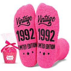 two pink mitts with the words vintage written on them next to a gift bag