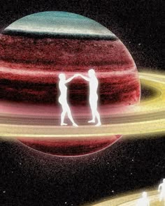 two people are standing in front of an image of saturn and the planet that appears to be red