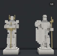 two white sculptures with gold accents on them