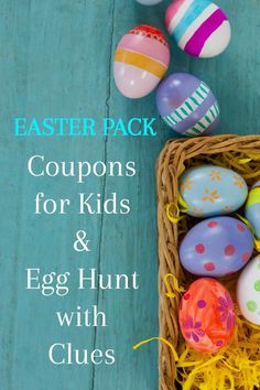 an easter basket filled with colorful eggs on top of a blue wooden table next to other items