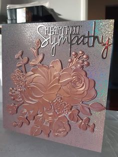 a close up of a greeting card with flowers on the front and back of it