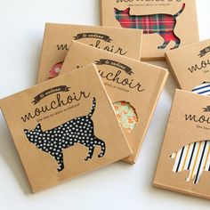 six small notebooks with different designs on them, each featuring a cat and dog