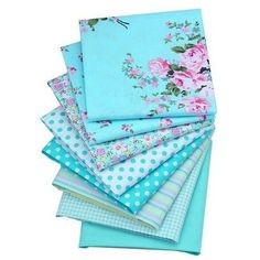 six different colors of fabric with flowers and polka dots on them, all in various sizes