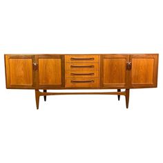 the sideboard has three drawers and two doors