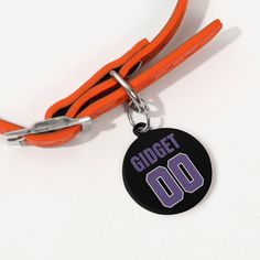 an orange lanyard with a black tag that says,'dodge 00'on it