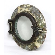 an old metal ring with rusted paint and black handles on a white background,