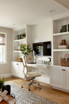 a living room filled with furniture and a flat screen tv