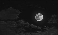 the full moon shines brightly in the night sky with clouds and stars around it