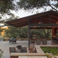 an outdoor dining area with tables and chairs