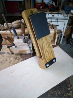 a piece of wood sitting on top of a wooden table next to other pieces of wood