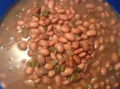 beans are being cooked in a pot on the stove