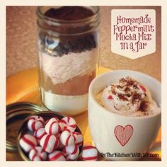 a cup of hot chocolate with marshmallows and peppermint in a jar