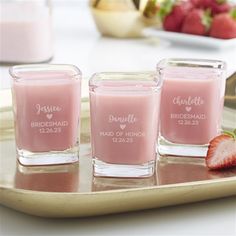 three shot glasses with the names of bridesmaid and maid of honor on them