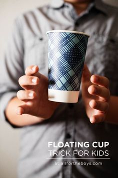 a man holding a coffee cup with the words floating cup trick for kids on it