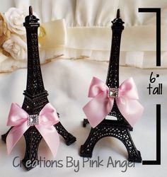 the eiffel tower is decorated with pink bows