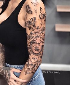 a woman with butterfly tattoos on her arm