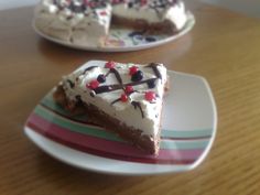 two pieces of cake on plates sitting on a table