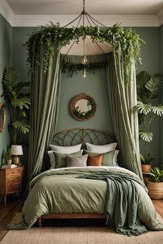 a bed with green sheets and pillows in a bedroom next to potted plants on the wall