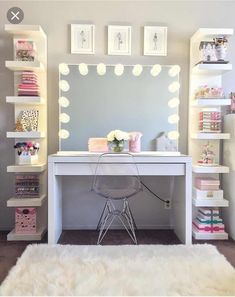 a white desk with a mirror and lights on it