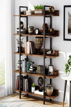 a bookshelf with several shelves and pictures on the wall