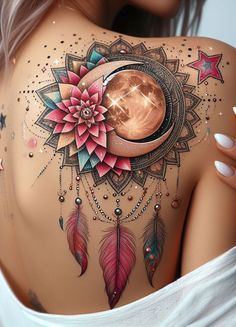 the back of a woman's body with tattoos on it and a moon in the middle