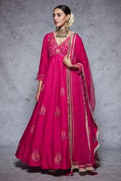 Rani pink anarkali highlighted with floral embroidery, V-neckline and gathers at the yoke. Comes with a churidar and a dupatta. - Aza Fashions Rani Pink Anarkali Suit, Mehendi Dresses, Floral Anarkali, Anarkali Designs, Pink Anarkali, Rani Pink, Embroidered Anarkali, Anarkali Dress Pattern, Potli Bag