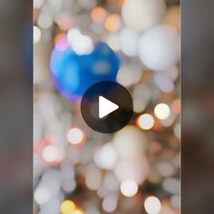 blurry image of lights in the background with a video play button highlighted on it