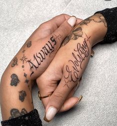 two people holding hands with tattoos on their arms and the words always love are written in cursive writing