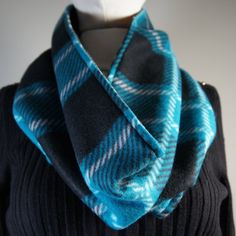 Repel the cold with a warm fleece scarf! Slip on a Cowl Scarf to coordinate with your coat or sweater. 2 layers of fleece fabric to perfectly fill the gap at the neck.Turquoise plaid on one side with black plaid on the other side.Double sided wear on one side one day the other side the next day. SPECIAL FEATURES: Fleece Centric Scarves are made to be extra warm with two layers of cozy, soft and luxurious fleece. These Fleece Scarves are available in 5 design styles and fleece fabrics range from Fleece Scarf Pattern, Fleece Scarves, Fleece Sewing Projects, Statement Scarf, Fleece Patterns, Turquoise And Black, Fleece Scarf, Reversible Scarf, Mesh Laundry Bags