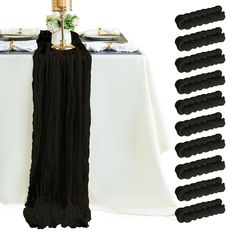 the table is set up with black and white linens