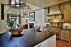 a large kitchen with an island in the middle