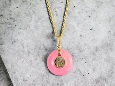 The 'Lantau Zhong Pink Jade Fu Fuku Fortune Pendant' is one of our classic designs. Bold, and charming, the pink jadeite creates an aura of playfulness and joy. (Chain not included) Stock ID: 9LZPJFFFP14Y Materials: 0.35g 14K Yellow Gold, 1.55g Pink Jade Dimensions: 22 x 16 x 3.5 Gross Weight: 1.90g Pink Jade Jewelry Gift, Marinette Aesthetic, Pink Jade Jewelry With Natural Stones, Pink Jade Necklace, Luxury Jade Pendant Necklaces, Chinese Jade Pendant, Pink Jade, Buddha Pendant, Long Drop Earrings