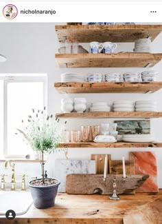 a kitchen counter topped with lots of shelves filled with dishes