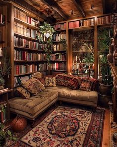 a living room filled with lots of furniture and bookshelves full of books on shelves