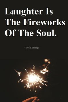 a person holding a sparkler with the words laughter is the fireworks of the soul